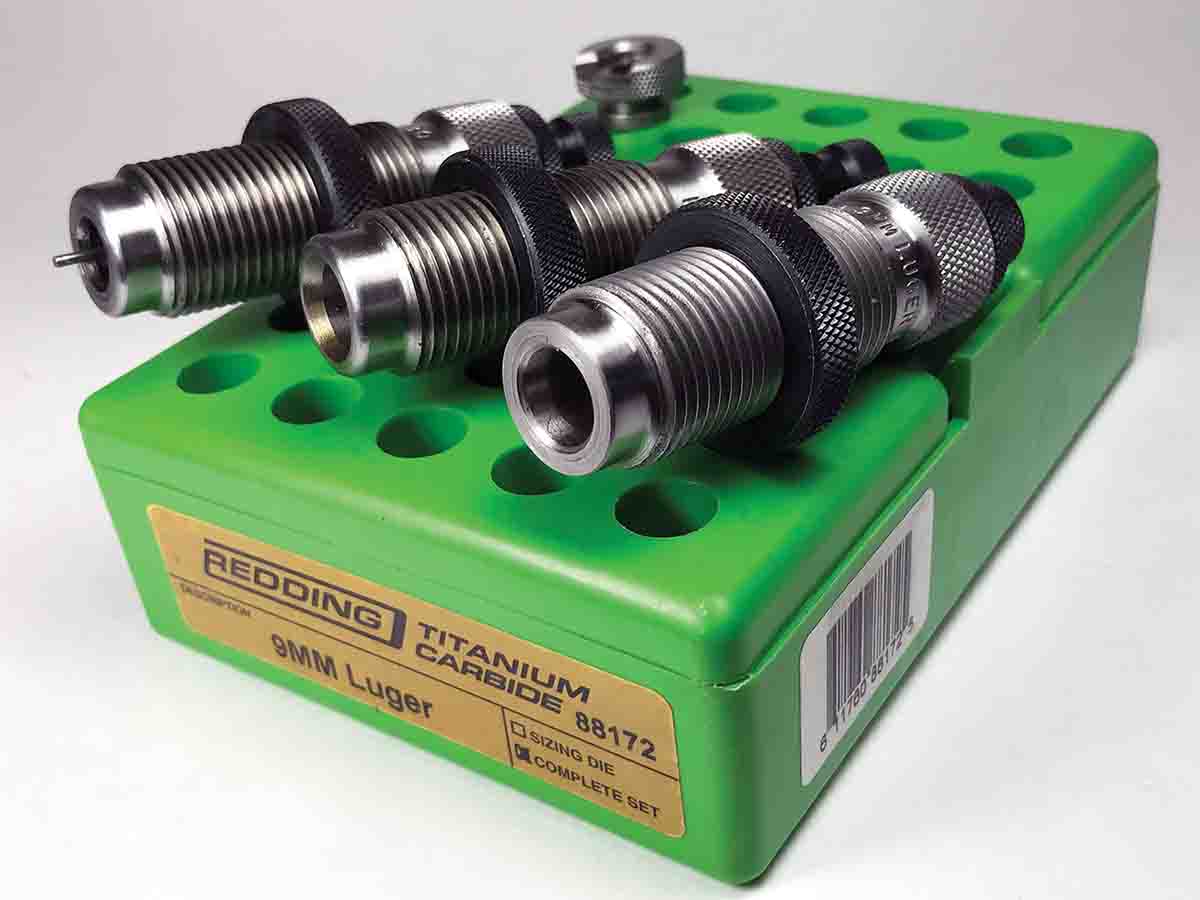 A three-die set is required for reloading handgun cases. This Redding set includes a carbide sizing die.